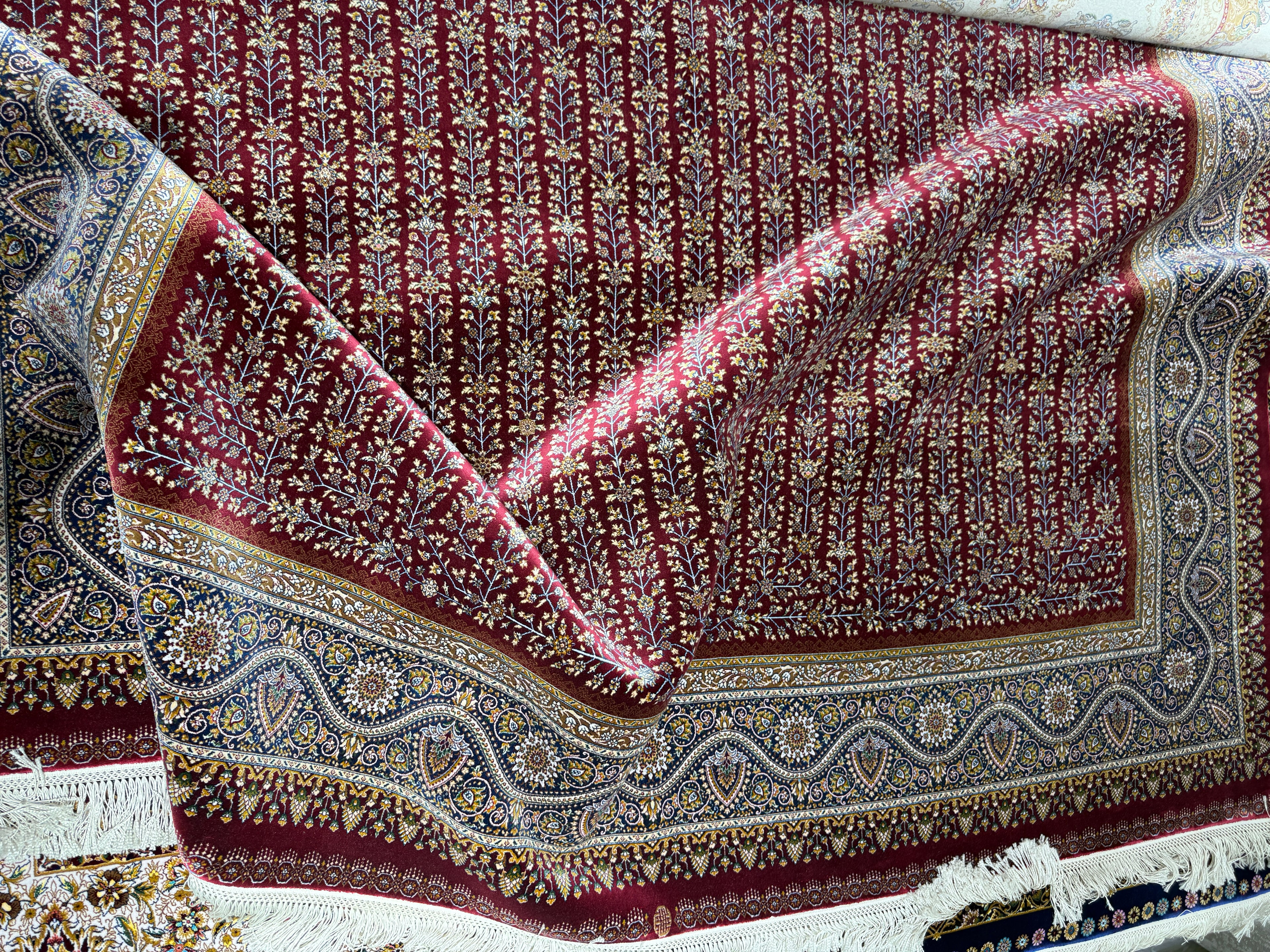 Close-up of a patterned rug with intricate designs.